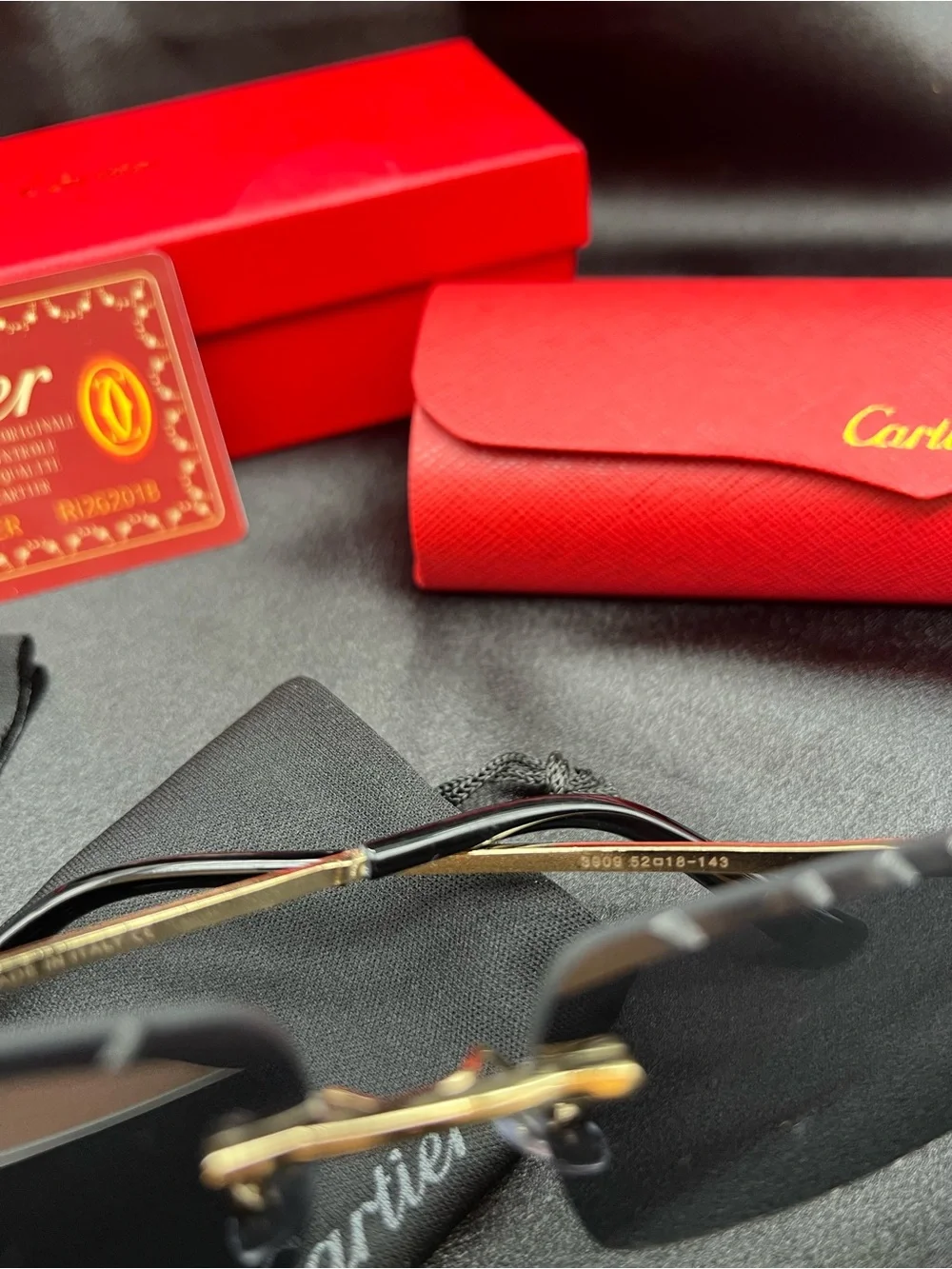 Cartier Men's Black & Gold Rimless Sunglasses with Scalloped Lenses
